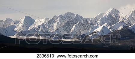 Snow covered mountain range with cloud in valley; Kananaskis, Alberta, Canada View Large Photo Image Stock Image - Snow covered mountain range with cloud in valley; Kananaskis, Alberta, Canada. Fotosearch