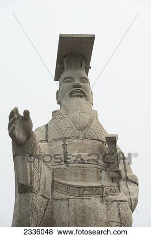 Stone statue of a male figure View Large Photo Image Stock Photo - Stone statue of a male figure. Fotosearch