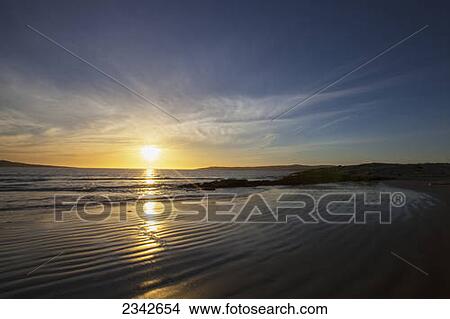 Picture - Sunset at Agata Beach; Luderitiz, Namibia. Fotosearch