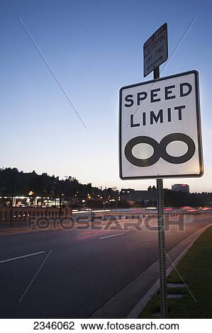 Stock Image - Traffic sign stating "Speed Limit Infinity" photographed from the Barham Boulevard freeway entrance; Los Angeles, California, United States of America. Fotosearch