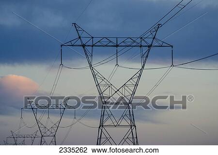 Stock Image - Transmission towers at dusk; Ohio, United States of America. Fotosearch