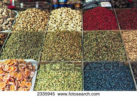 Stock Photography - Variety of dried fruit and nuts on display for sale. Fotosearch