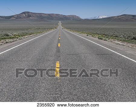 View looking east down Highway 50, dubbed the loneliest road, in central Nevada between Fallon and Austin; Nevada, United States of America View Large Photo Image Stock Image - View looking east down Highway 50, dubbed the loneliest road, in central Nevada between Fallon and Austin; Nevada, United States of America. Fotosearch