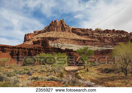 Stock Photo - View of sandstone rock formation called The Castle in Capital Reef National Park; Torrey, Utah, United States of America. Fotosearch