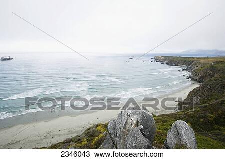 View of the Pacific Ocean from the top of a rock during an overcast day; Big Sur, California, United States of America View Large Photo Image Stock Image - View of the Pacific Ocean from the top of a rock during an overcast day; Big Sur, California, United States of America. Fotosearch