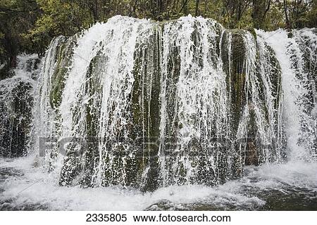 Waterfalls splashing over a cliff View Large Photo Image Stock Photography - Waterfalls splashing over a cliff. Fotosearch