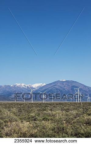 Picture - Wind generators in eastern Nevada along Highway 50 with the Schell Range mountains in the background; Nevada, United States of America. Fotosearch
