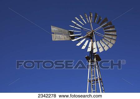 Stock Photo - Windmill against a blue sky; Klein-Aus Vista, Namibia. Fotosearch