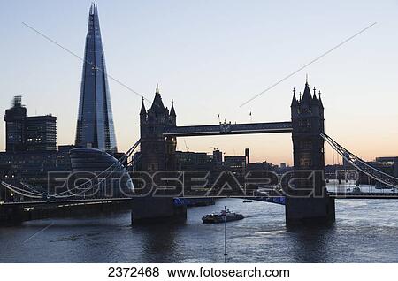 A Bridge Crossing The River Thames And The Shard In The Background; London, England View Large Photo Image Stock Photo - A Bridge Crossing The River Thames And The Shard In The Background; London, England. Fotosearch