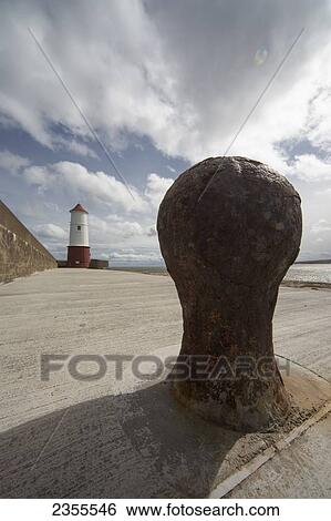 A Concrete Pier Leading To A Lighthouse; Berwick-Upon-Tweed, Northumberland, England View Large Photo Image Stock Photograph - A Concrete Pier Leading To A Lighthouse; Berwick-Upon-Tweed, Northumberland, England. Fotosearch