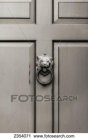 Stock Image - A Door Knocker On A Door; Ohio, United States Of America. Fotosearch