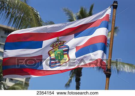 Picture - A Flag Flying With The Hawaiian Royal Seal; Oahu, Hawaii, United States Of America. Fotosearch