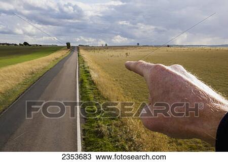 A Hand Pointing Down A Rural Road; Hertfordshire, England View Large Photo Image Stock Image - A Hand Pointing Down A Rural Road; Hertfordshire, England. Fotosearch