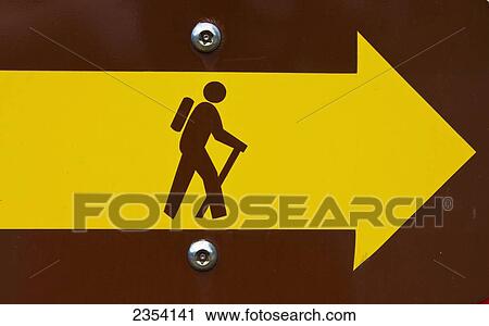 Stock Image - A Sign Points To A Hiking Trail; Oahu, Hawaii, United States Of America. Fotosearch