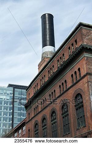 Stock Photograph - A Smokestack On Top Of A Building; Seattle, Washington, United States Of America. Fotosearch