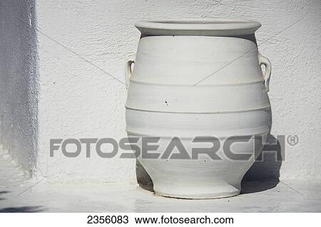 A White Pot Sits Beside A White Wall; Firostefani, Santorini, Cyclades, Greece View Large Photo Image Stock Image - A White Pot Sits Beside A White Wall; Firostefani, Santorini, Cyclades, Greece. Fotosearch
