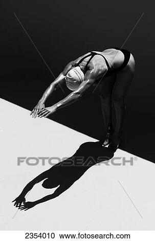 A Woman Prepares To Jump Backwards Off The Edge Of A Pool Into The Water; Tarifa, Cadiz, Andalusia, Spain View Large Photo Image Stock Image - A Woman Prepares To Jump Backwards Off The Edge Of A Pool Into The Water; Tarifa, Cadiz, Andalusia, Spain. Fotosearch