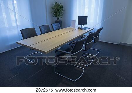 An Empty Meeting Room With A Computer On A Table And Six Chairs; Locarno, Ticino, Switzerland View Large Photo Image Stock Photography - An Empty Meeting Room With A Computer On A Table And Six Chairs; Locarno, Ticino, Switzerland. Fotosearch