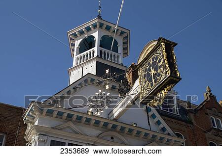 An Ornate Clock Mounted On The Side Of A Building; Guildford, Surrey, England View Large Photo Image Stock Photo - An Ornate Clock Mounted On The Side Of A Building; Guildford, Surrey, England. Fotosearch