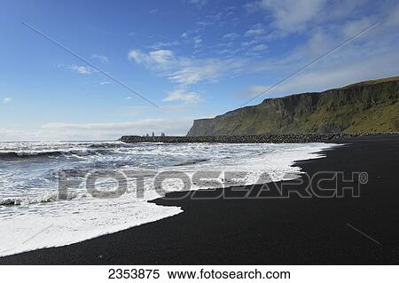 Stock Photography - Black Lava Beach With Basalt Stacks Of Reynisdrangar In The Background; Vik, Vestur-Skaftafellssysla, Iceland. Fotosearch