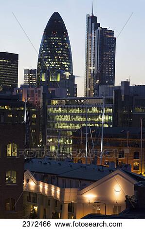 Buildings Illuminated With Light At Dusk; London, England View Large Photo Image Stock Photograph - Buildings Illuminated With Light At Dusk; London, England. Fotosearch
