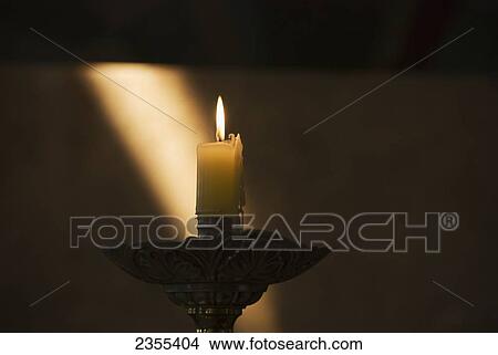 Candle Burning With Sun Ray On The Wall In The Background; Mendoza, Argentina View Large Photo Image Picture - Candle Burning With Sun Ray On The Wall In The Background; Mendoza, Argentina. Fotosearch