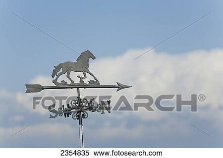 Close Up Of A Metal Horse Weather Vane With Storm Clouds And Blue Sky In The Background; Calgary, Alberta, Canada View Large Photo Image Stock Photography - Close Up Of A Metal Horse Weather Vane With Storm Clouds And Blue Sky In The Background; Calgary, Alberta, Canada. Fotosearch
