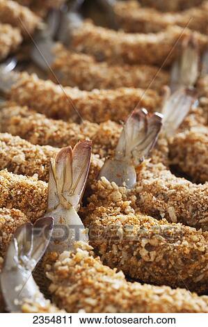 Close Up Of Breaded Shrimp In A Row On A Cooking Sheet With Tails Exposed; Calgary, Alberta, Canada View Large Photo Image Stock Image - Close Up Of Breaded Shrimp In A Row On A Cooking Sheet With Tails Exposed; Calgary, Alberta, Canada. Fotosearch