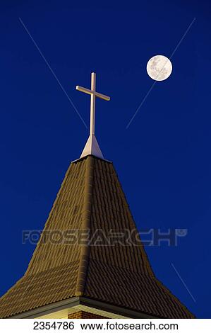 Close Up Of Church Steeple With Cross At Night With Full Moon In A Deep Blue Sky; Calgary, Alberta, Canada View Large Photo Image Stock Photograph - Close Up Of Church Steeple With Cross At Night With Full Moon In A Deep Blue Sky; Calgary, Alberta, Canada. Fotosearch