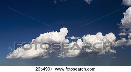 Fluffy White Clouds And Blue Sky; Calgary, Alberta, Canada View Large Photo Image Stock Photo - Fluffy White Clouds And Blue Sky; Calgary, Alberta, Canada. Fotosearch