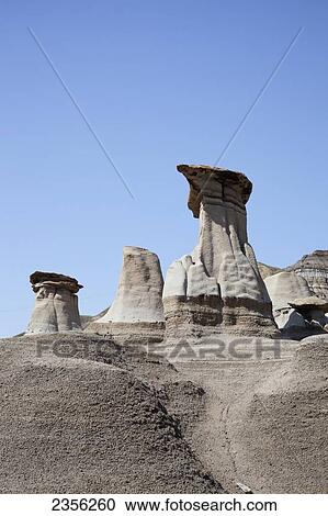 Hoodoos In Drumheller Formed Between 70 To 75 Million Years Ago In The Cretaceous Period; Drumheller, Alberta, Canada View Large Photo Image Stock Image - Hoodoos In Drumheller Formed Between 70 To 75 Million Years Ago In The Cretaceous Period; Drumheller, Alberta, Canada. Fotosearch
