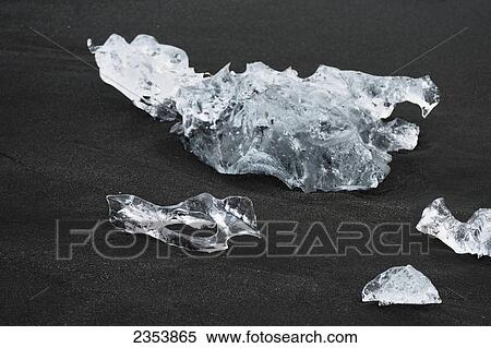 Pieces Of Ice On Black Sand By The Glacial Lagoon; Jokulsarlon, Austur-Skaftrafellssysla, Iceland View Large Photo Image Stock Photography - Pieces Of Ice On Black Sand By The Glacial Lagoon; Jokulsarlon, Austur-Skaftrafellssysla, Iceland. Fotosearch