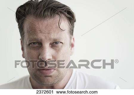 Portrait Of A Man Against A White Background; Locarno, Ticino, Switzerland View Large Photo Image Stock Image - Portrait Of A Man Against A White Background; Locarno, Ticino, Switzerland. Fotosearch