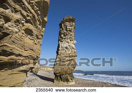 Stock Image - Sea Stack Known As Lot's Wife; South Shields, Tyne And Wear, England. Fotosearch