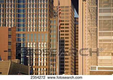 Stock Image - Skyscrapers Downtown And An American Flag; Phoenix, Arizona, United States Of America. Fotosearch