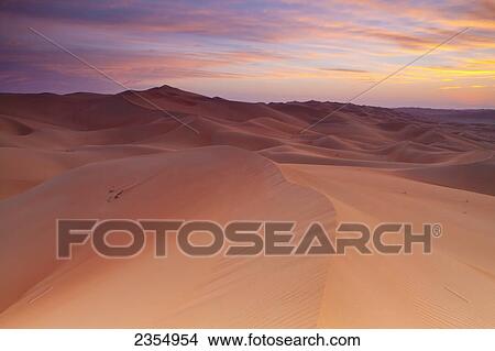 Picture - Sunset Over The Sand Dunes; Liwa Oasis, Abu Dhabi, United Arab Emirates. Fotosearch
