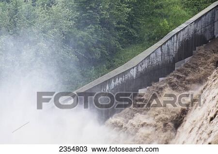 The Power Of Rushing Water During A Flood; Calgary, Alberta, Canada View Large Photo Image Stock Image - The Power Of Rushing Water During A Flood; Calgary, Alberta, Canada. Fotosearch