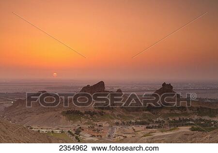 Stock Image - The View From Jebel Hafeet Mountain At Sunset; Al Ain, Abu Dhabi, United Arab Emirates. Fotosearch