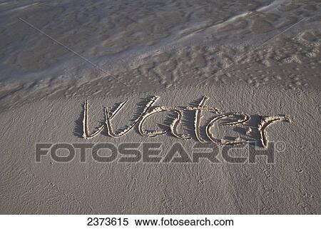 The word water handwritten in the sand at the water's edge; Tulum, Mexico View Large Photo Image Stock Photography - The word water handwritten in the sand at the water's edge; Tulum, Mexico. Fotosearch