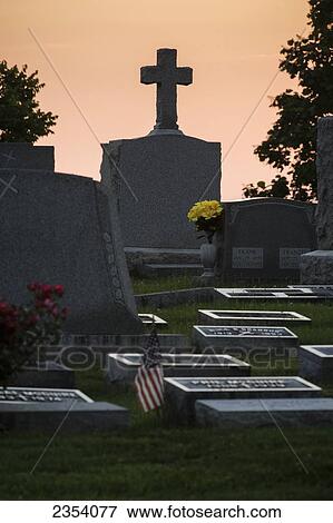 Tombstones In A Cemetery At Sunset; Ohio, United States Of America View Large Photo Image Stock Photo - Tombstones In A Cemetery At Sunset; Ohio, United States Of America. Fotosearch