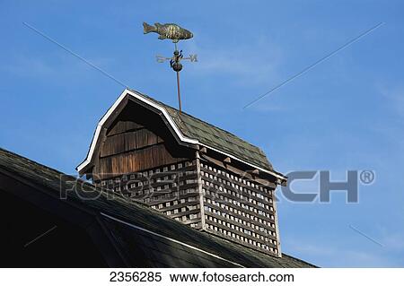 Weather Vane On An Old Barn Roof; North Hatley, Quebec, Canada View Large Photo Image Stock Photography - Weather Vane On An Old Barn Roof; North Hatley, Quebec, Canada. Fotosearch