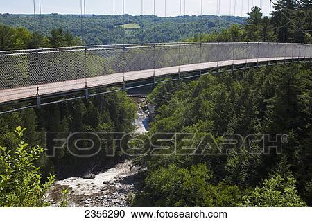 Stock Image - World's Longest Suspended Footbridge Above Coaticook River Gorge; Coaticook, Quebec, Canada. Fotosearch