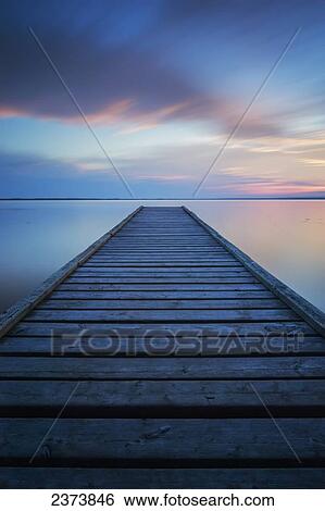 Stock Photograph - 6 minute exposure of an old dock, Queen Elizabeth Provincial Park; Alberta, Canada. Fotosearch