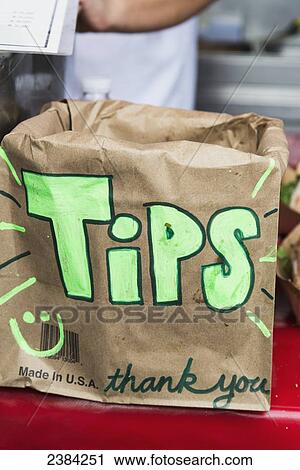 A bag for collecting tips at a barbecue stand, Ferry Plaza Farmer's Market; San Francisco, California, United States of America View Large Photo Image Stock Image - A bag for collecting tips at a barbecue stand, Ferry Plaza Farmer's Market; San Francisco, California, United States of America. Fotosearch