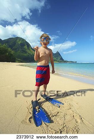 A boy on the beach with snorkelling gear; Kauai, Hawaii, United States of America View Large Photo Image Stock Image - A boy on the beach with snorkelling gear; Kauai, Hawaii, United States of America. Fotosearch