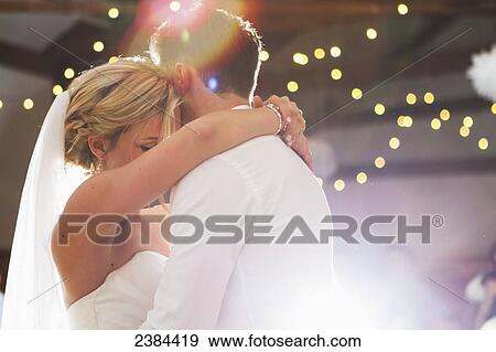 A couple dances on their wedding day; British Columbia, Canada View Large Photo Image Stock Photo - A couple dances on their wedding day; British Columbia, Canada. Fotosearch