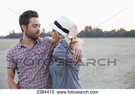 A couple in an embrace along the water's edge; Victoria, British Columbia, Canada View Large Photo Image Stock Image - A couple in an embrace along the water's edge; Victoria, British Columbia, Canada. Fotosearch
