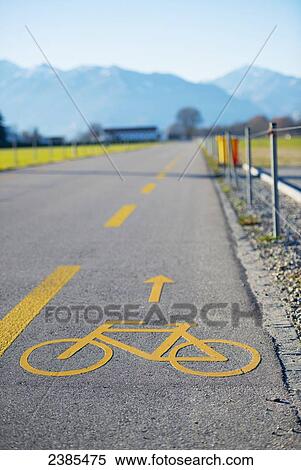 Stock Photography - A cycling lane on the side of a road; Locarno, Ticino, Switzerland. Fotosearch