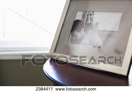 Stock Photo - A frame picture of a couple on a table; British Columbia, Canada. Fotosearch