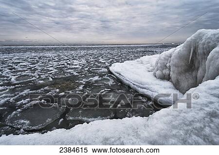 A large chunk of ice dominates as the smaller floaters dance around it in Lake Michigan; Wisconsin, United States of America View Large Photo Image Stock Photography - A large chunk of ice dominates as the smaller floaters dance around it in Lake Michigan; Wisconsin, United States of America. Fotosearch